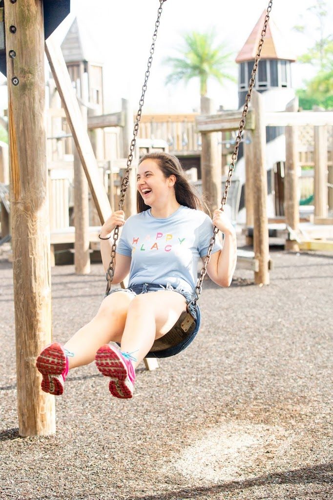 Playing-At-The-Playground-Happy-Place-Tee-Red-Dress-Boutique-Frayed-Denim-Shorts-Pink-Nike-Sneakers