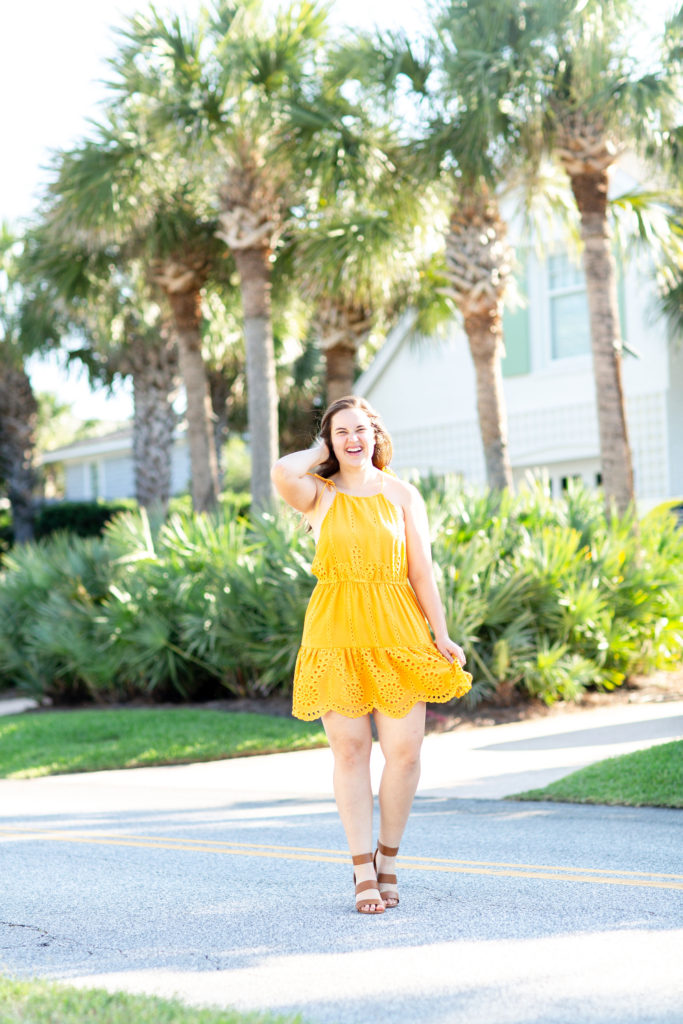 Brunette-Girl-Wearing-Revolve-Lovers-Friends-Yellow-Evie-Mini-Sundress-With-Brown-DSW-Sandals