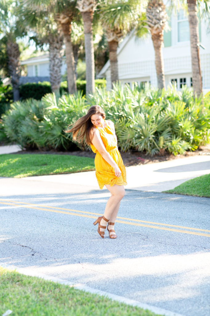 Brunette-Girl-Wearing-Revolve-Lovers-Friends-Yellow-Evie-Mini-Sundress-With-Brown-DSW-Sandals