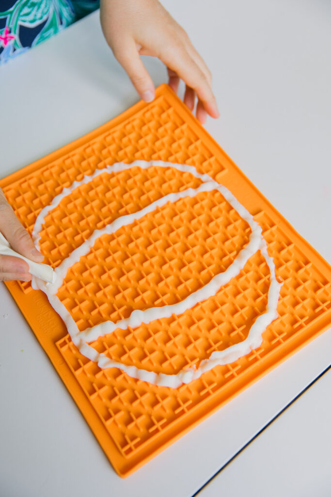 Frozen yogurt dog treats on licking mat for dogs Sparkles and Sunshine Blog