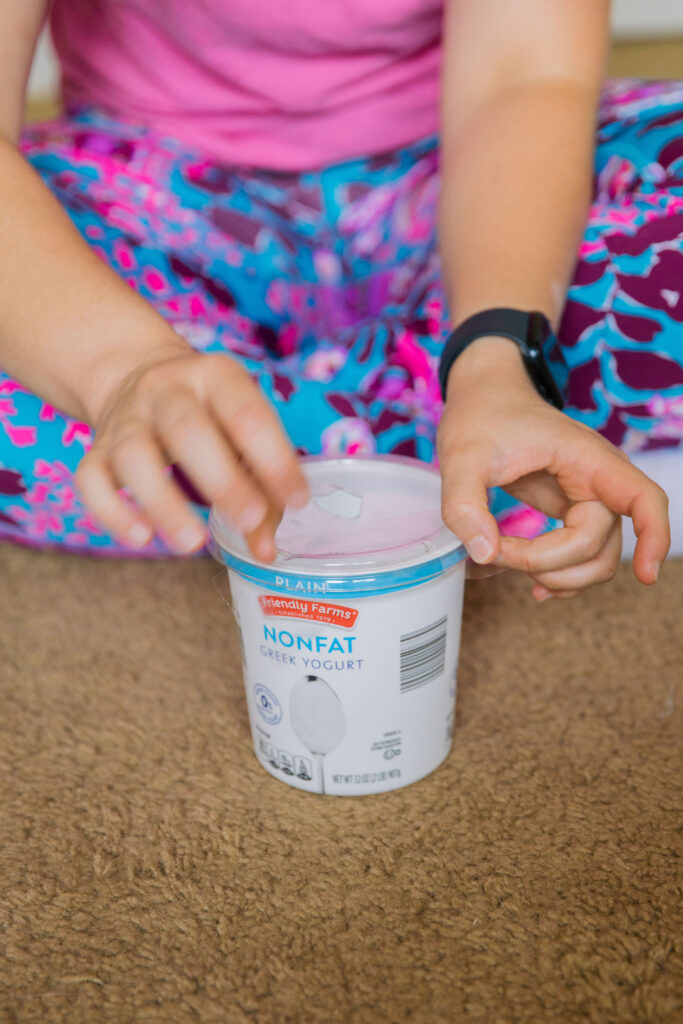 Boredom buster for dogs with yogurt container sparkles and sunshine blog